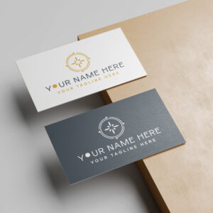 Two business cards, one white and one dark blue, featuring a gold compass-style logo and placeholder text for a name and tagline.